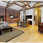 Exposed Brick And Trusses (And Big Window To Expose Yourself)
